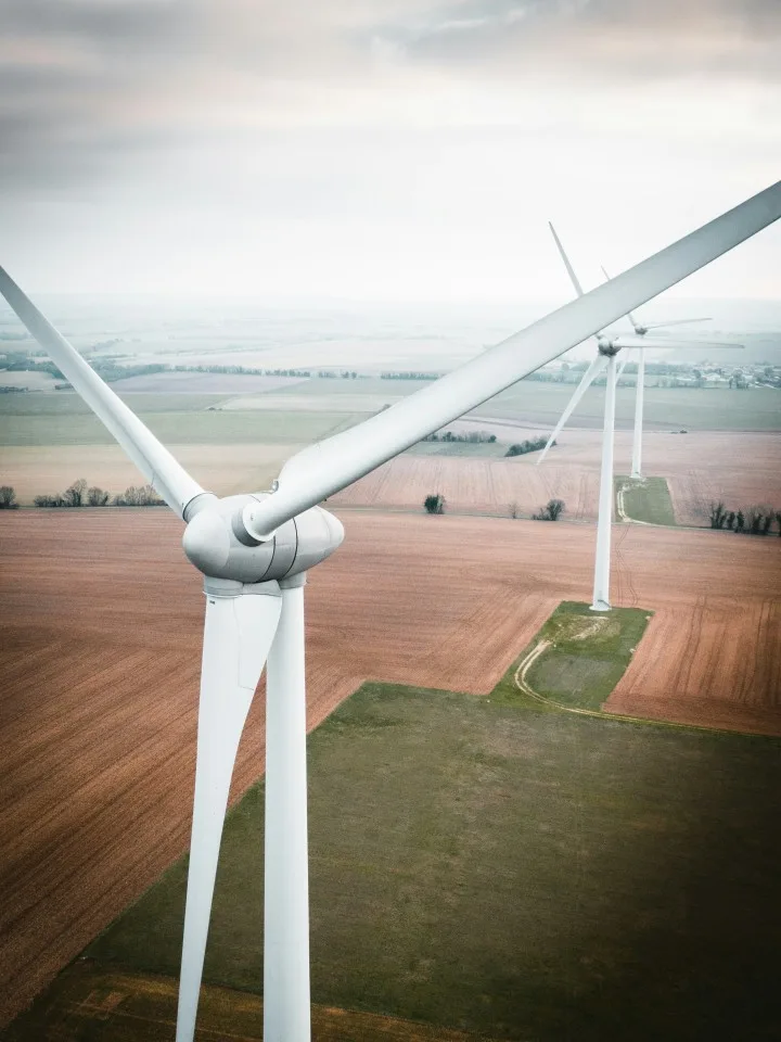 Modern wind turbines generating renewable energy for sustainable community power planning and environmental conservation